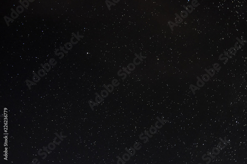 Stars on a dark blue sky at night.