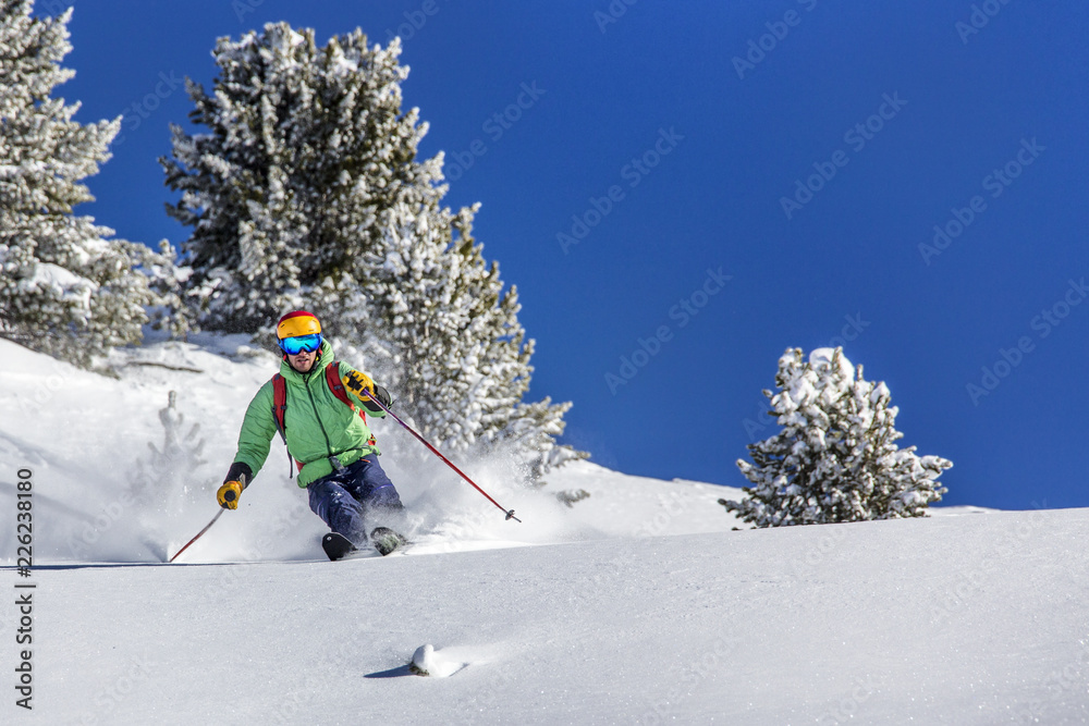 Offpiste skiing in deep powder snow Offpiste skiing in deep powder snow