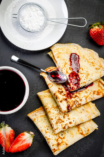 Crepes with strawberries and jam