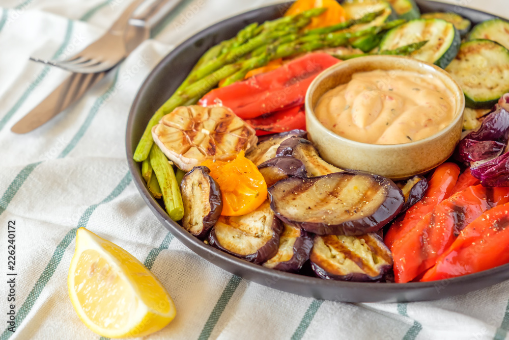 Grilled vegetables on a plate with sauce Grilled vegetables on a plate with sauce