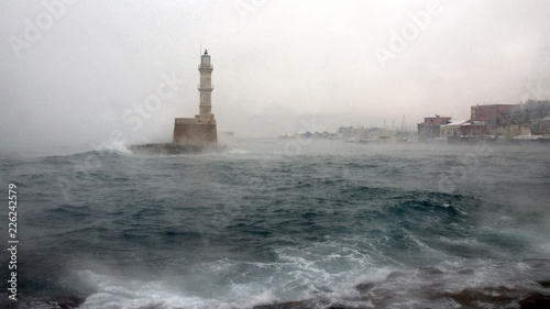 The lighthouse at the Venecian harbour of Chania, Crete photo