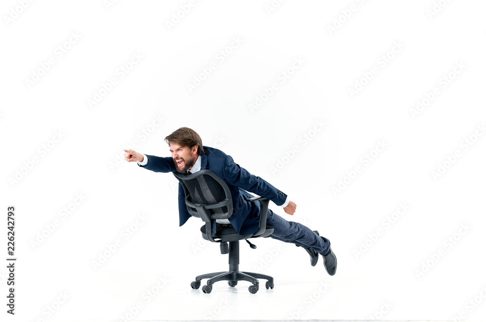 business man riding a chair