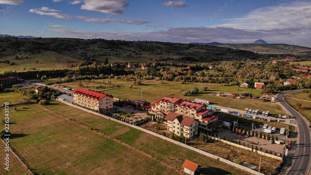 Aerial view of Bran town near the Bran castle in Transylvania, Romania, Brasov region. Cloudy day with beautiful clouds. Aerial view of Bran town near the Bran castle in Transylvania, Romania, Brasov region. Cloudy day with beautiful clouds.