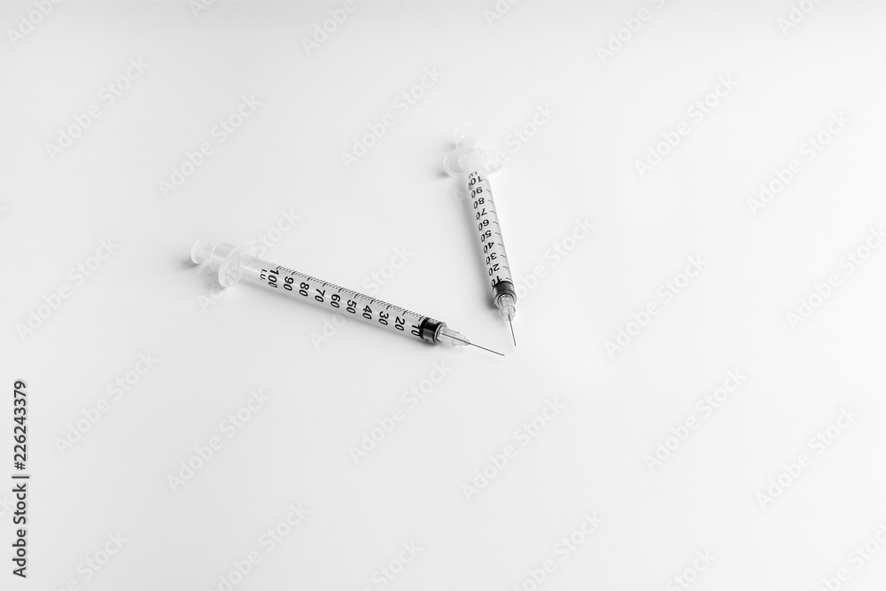 Two empty syringe closeup isolated on white background. Syringe 1ml for