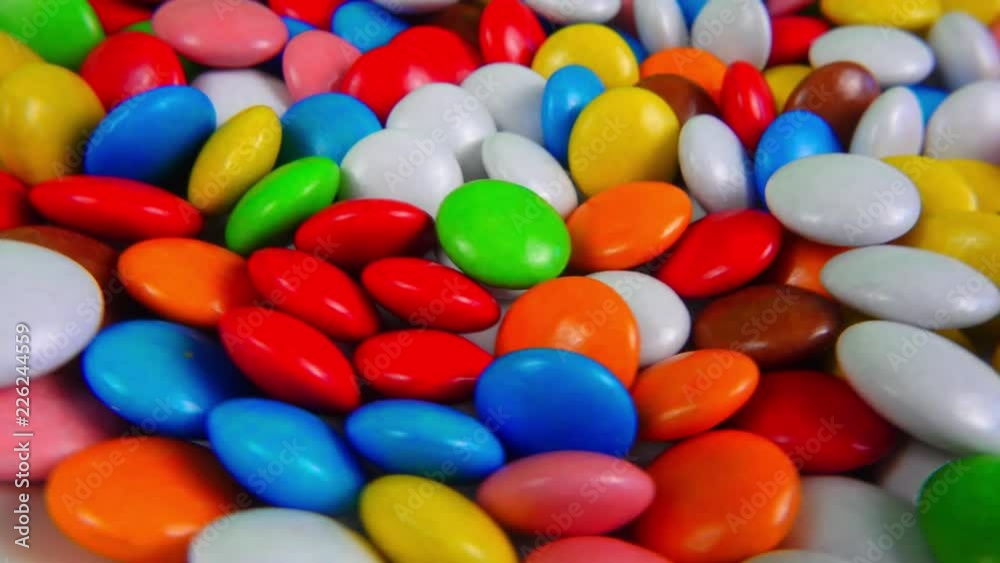 Multicolored candy, dragee on a plate, close-up. Multicolored candy, dragee on a plate, close-up.