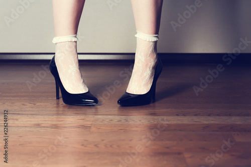 pin up woman legs in black high heels and white socks. Sexy woman legs fetish