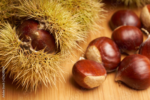 Sweet chestnut on wooden background