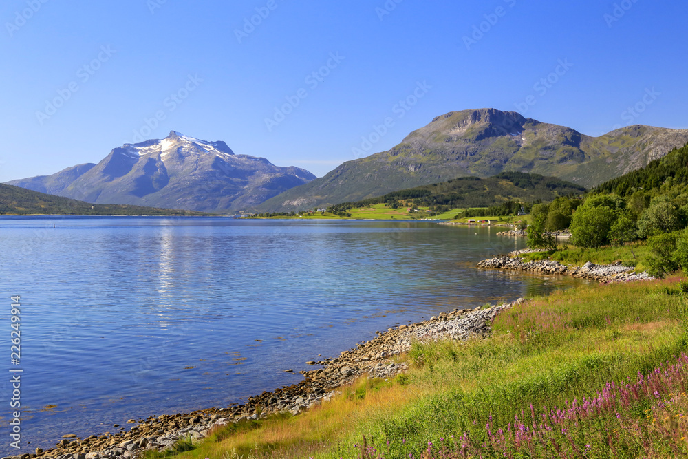 Fjord and mountain sommer time in Tjeldssund fjord Northern Norway Fjord and mountain sommer time in Tjeldssund fjord Northern Norway