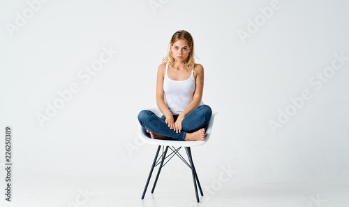 woman sitting on a chair in the studio