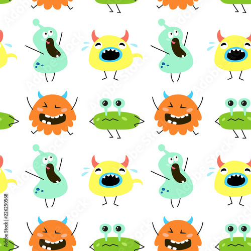 Seamless pattern with cartoon monsters. © Evgeniya M