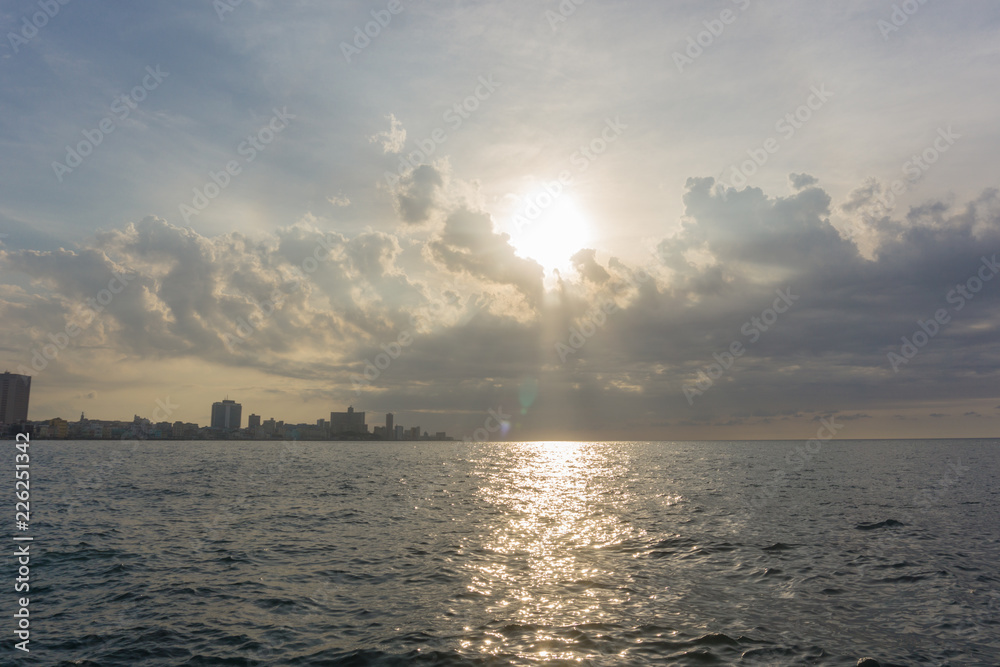 Sunset over the ocean, sun reflection in water Sunset over the ocean, sun reflection in water