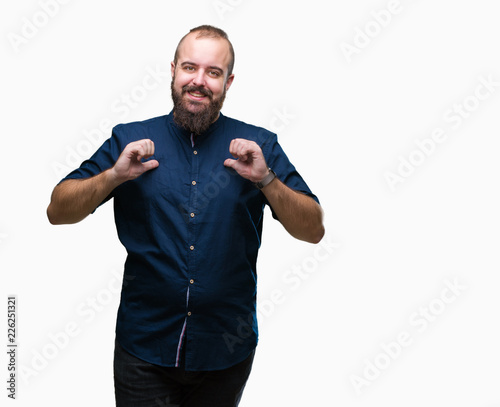 Young caucasian hipster man over isolated background looking confident with smile on face, pointing oneself with fingers proud and happy.
