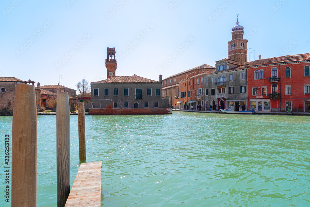 Old town of Murano island with lagoon water of canal, Venice, Italy
