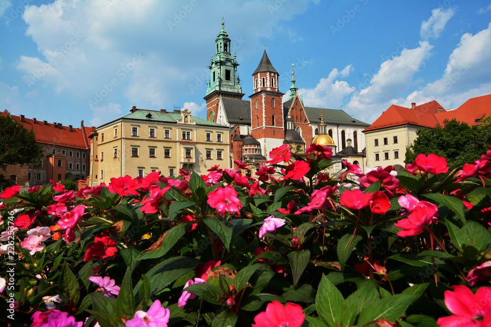 Beautiful sightseeing with Wawel Royal Castle and colorful flowers in Krakow, Poland