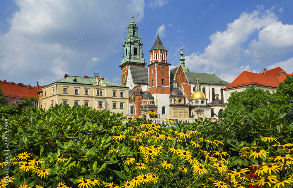 Beautiful sightseeing with Wawel Royal Castle and colorful flowers in Krakow, Poland