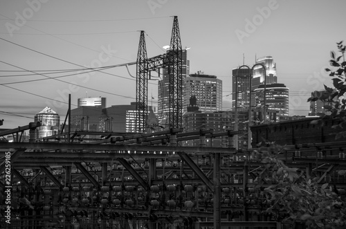 Black and White cityscape skyline of Downtown Minneapolis Minnesota in the Twin Cities Metro area. Long exposure reflection on Mississippi River  night. View from St. Anthony Main