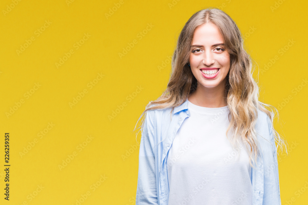 Beautiful young blonde woman over isolated background with a happy and cool smile on face. Lucky person. Beautiful young blonde woman over isolated background with a happy and cool smile on face. Lucky person.