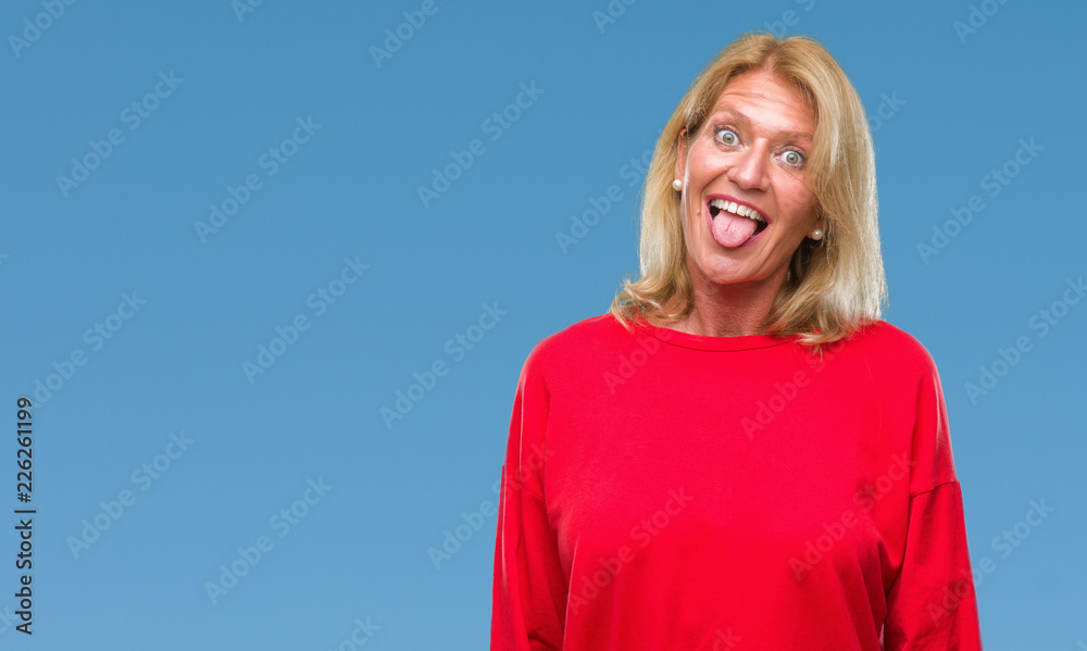 Middle age blonde woman over isolated background sticking tongue out happy with funny expression. Emotion concept. Middle age blonde woman over isolated background sticking tongue out happy with funny expression. Emotion concept.