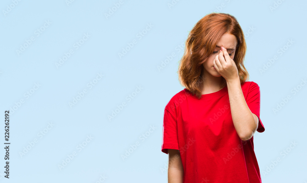 Young beautiful woman over isolated background tired rubbing nose and eyes feeling fatigue and headache. Stress and frustration concept. Young beautiful woman over isolated background tired rubbing nose and eyes feeling fatigue and headache. Stress and frustration concept.