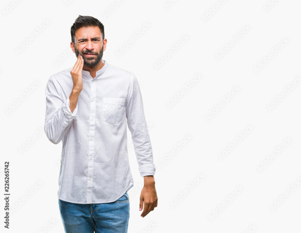 Adult hispanic man over isolated background touching mouth with hand with painful expression because of toothache or dental illness on teeth. Dentist concept. Adult hispanic man over isolated background touching mouth with hand with painful expression because of toothache or dental illness on teeth. Dentist concept.