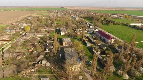 Top view of the village. One can see the roofs of the houses and gardens. Road the village. Village bird's-eye view. photo