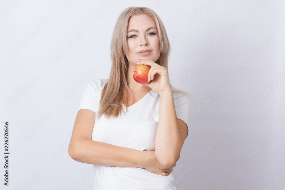 Beautiful blonde woman with apple Beautiful blonde woman with apple