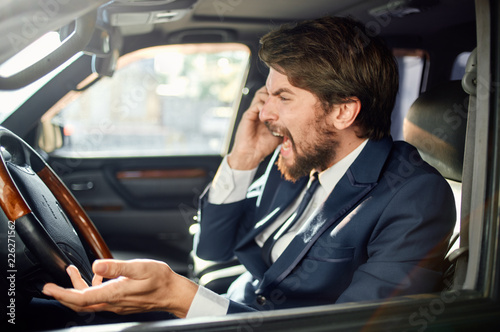 emotional man screaming into the phone while sitting in the car © SHOTPRIME STUDIO