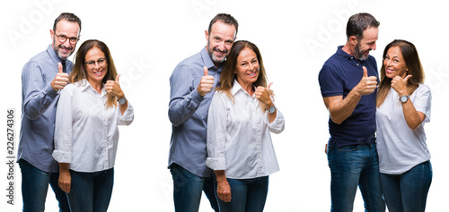 Collage of middle age mature beautiful couple of senior wife and husband over white isolated background doing happy thumbs up gesture with hand. Approving expression looking at the camera