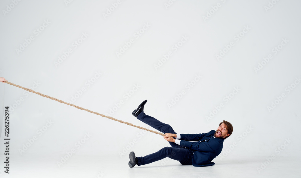 man lies on the floor and pulls the rope man lies on the floor and pulls the rope