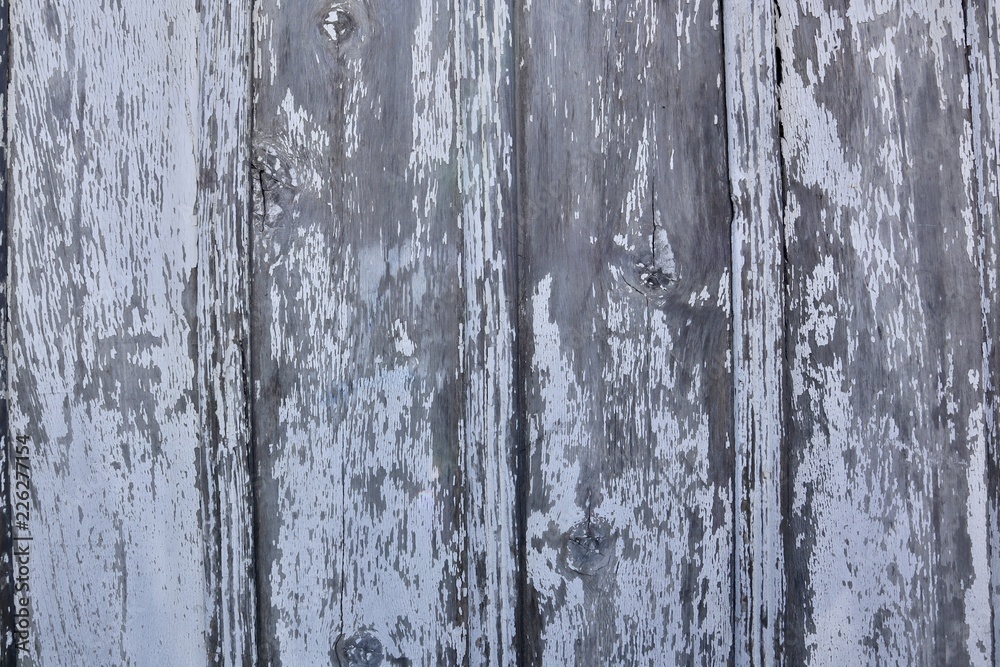 old weathered wooden fence with chipped white paint background old weathered wooden fence with chipped white paint background