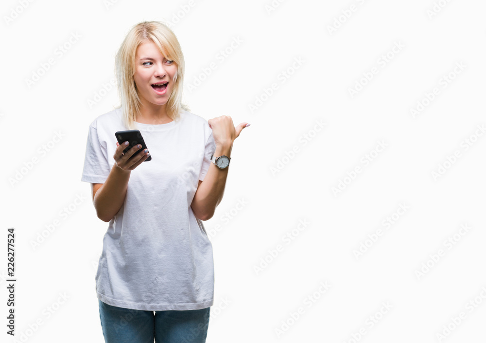 Young beautiful blonde woman using smartphone over isolated background pointing and showing with thumb up to the side with happy face smiling Young beautiful blonde woman using smartphone over isolated background pointing and showing with thumb up to the side with happy face smiling