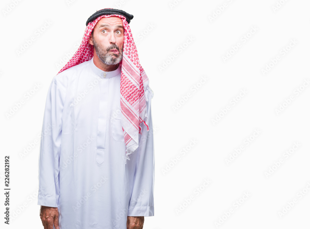 Senior arab man wearing keffiyeh over isolated background making fish face  with lips, crazy and comical gesture. Funny expression. Stock Photo | Adobe  Stock