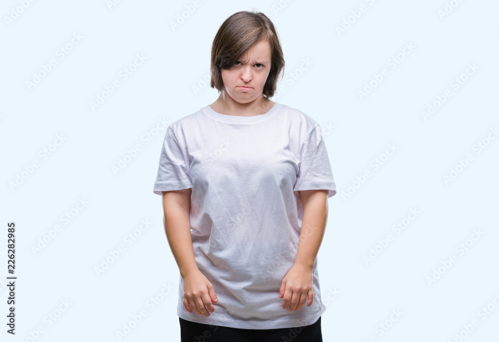 Young adult woman with down syndrome over isolated background skeptic and nervous, frowning upset because of problem. Negative person. Young adult woman with down syndrome over isolated background skeptic and nervous, frowning upset because of problem. Negative person.
