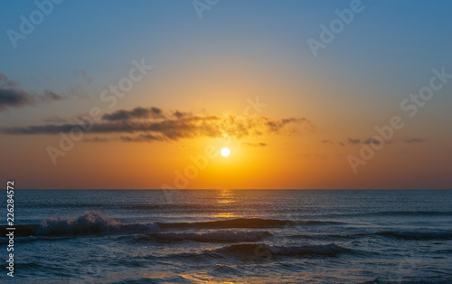 Amazing colorful sunrise at sea © Vastram