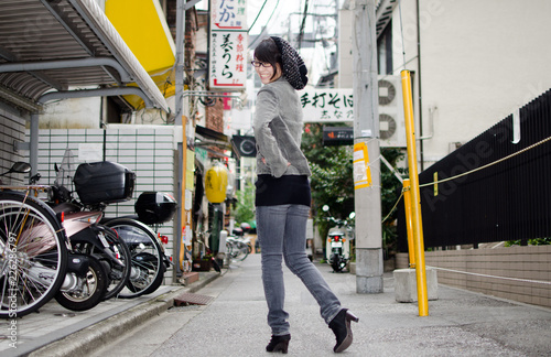 Japanese Girl poses on the street in Toranomon, Japan. Toranomon is a business district in Tokyo. photo