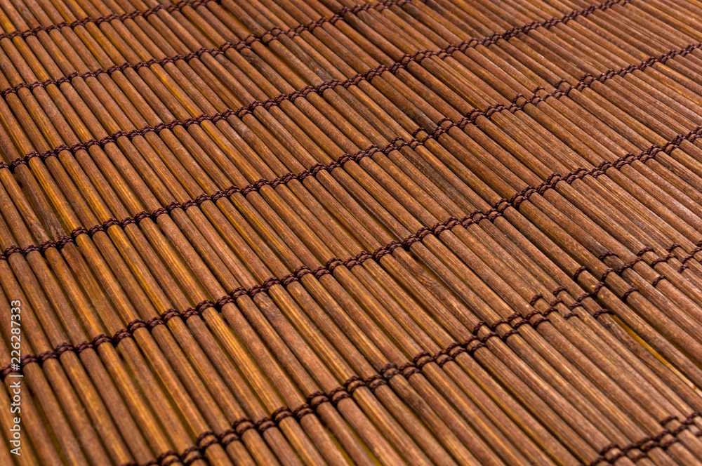 bamboo Mat - stand food, close-up, wooden background bamboo Mat - stand food, close-up, wooden background