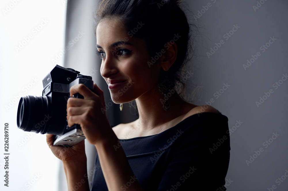 pretty lady with a camera in her hand pretty lady with a camera in her hand