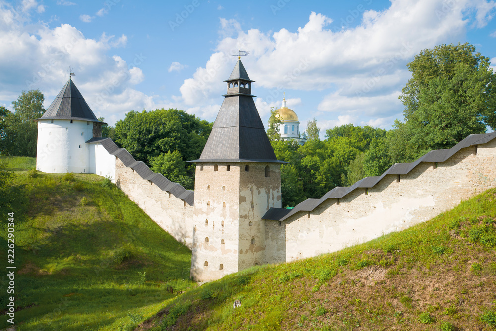 At the walls of the Holy Dormition Pskovo-Pechersky Monastery on a sunny June day. Pechory, Russia