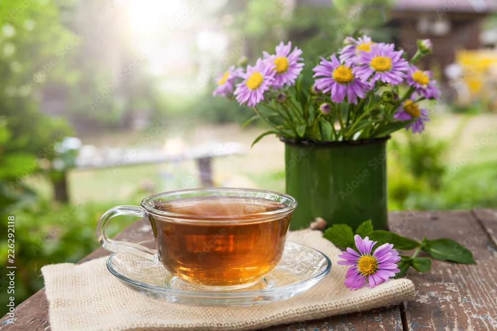 A Cup of tea on a wooden table.