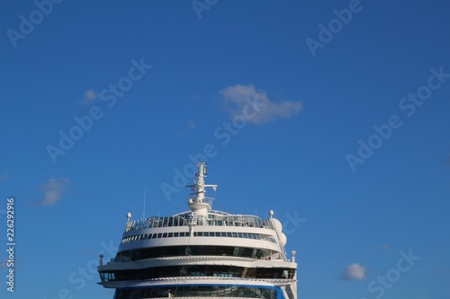 Ship's bridge of a cruise liner against blue sky - front view