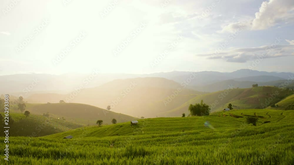 Rainy with sun background and rice terrace field, Pabongpeang, in Maejam, Chiangmai, Thailand Rainy with sun background and rice terrace field, Pabongpeang, in Maejam, Chiangmai, Thailand