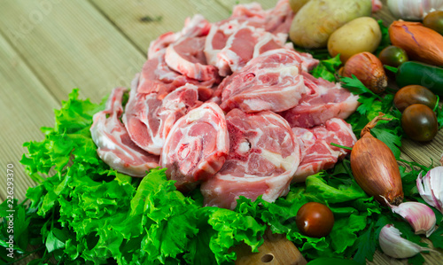 Raw lamb meat with vegetables