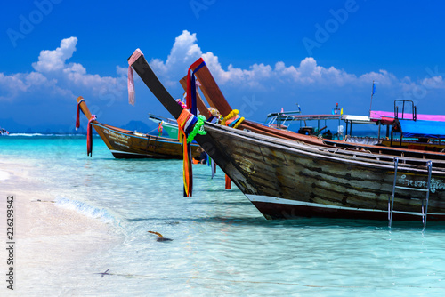Long tail boats on white sand beach, Bamboo island, Phi Phi, And