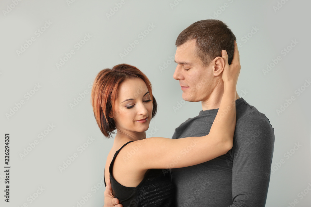 Cute loving couple on color background