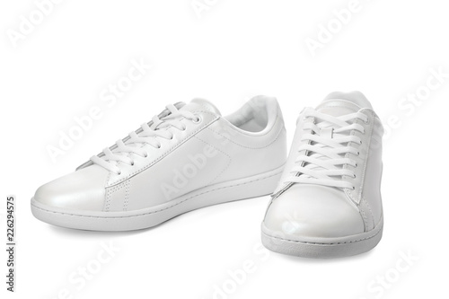 Pair of trendy sneakers on white background