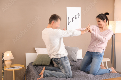 Lovely couple dancing on be...