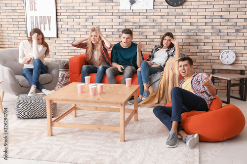 Emotional young people watc...