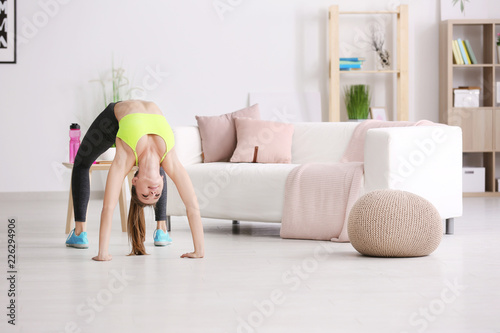 Beautiful young woman doing...
