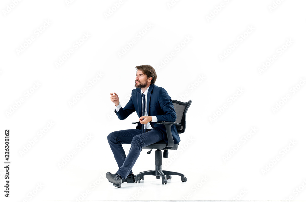 business man sitting in an office chair business man sitting in an office chair