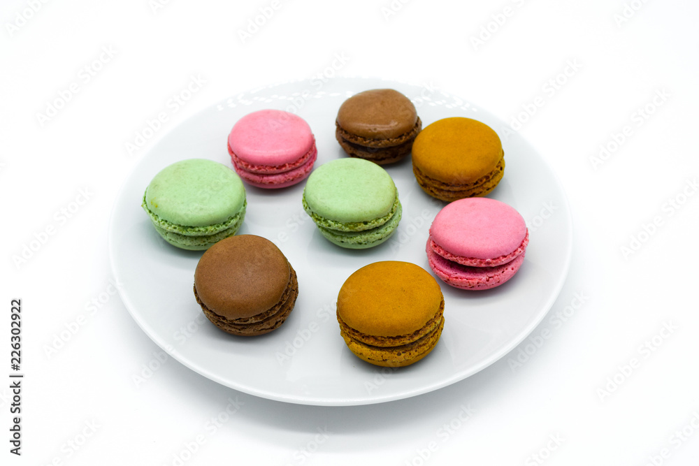 macarons on plate, sweet colorful macarons on white background macarons on plate, sweet colorful macarons on white background